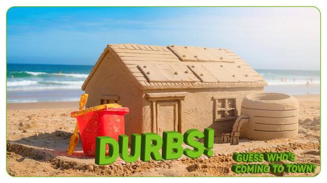 A detailed sandcastle house on a Durban beach, with 'DURBS!' lettering and the Guess Who's Coming to Town tagline